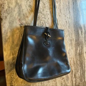 A vintage Longchamp handbag in black leather